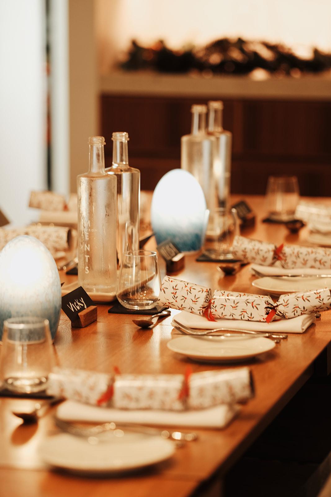 Place settings along the dinner table, a name card reading Vicky