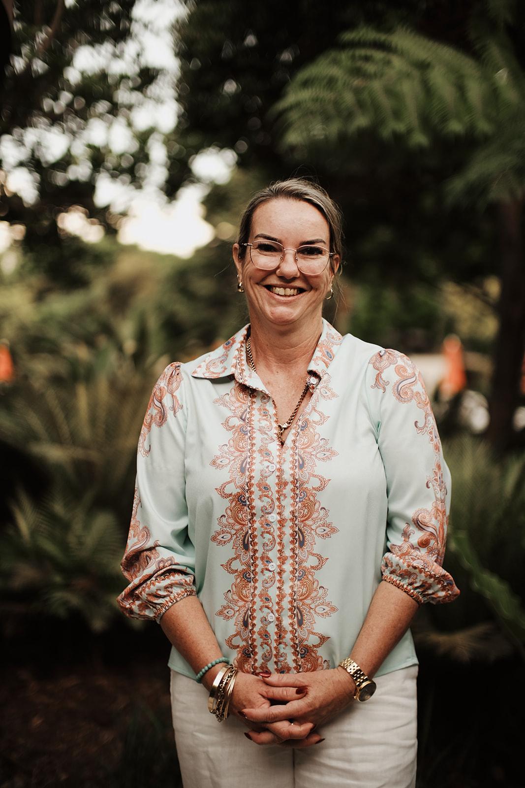 Portrait of a woman from the retreat in a floral top
