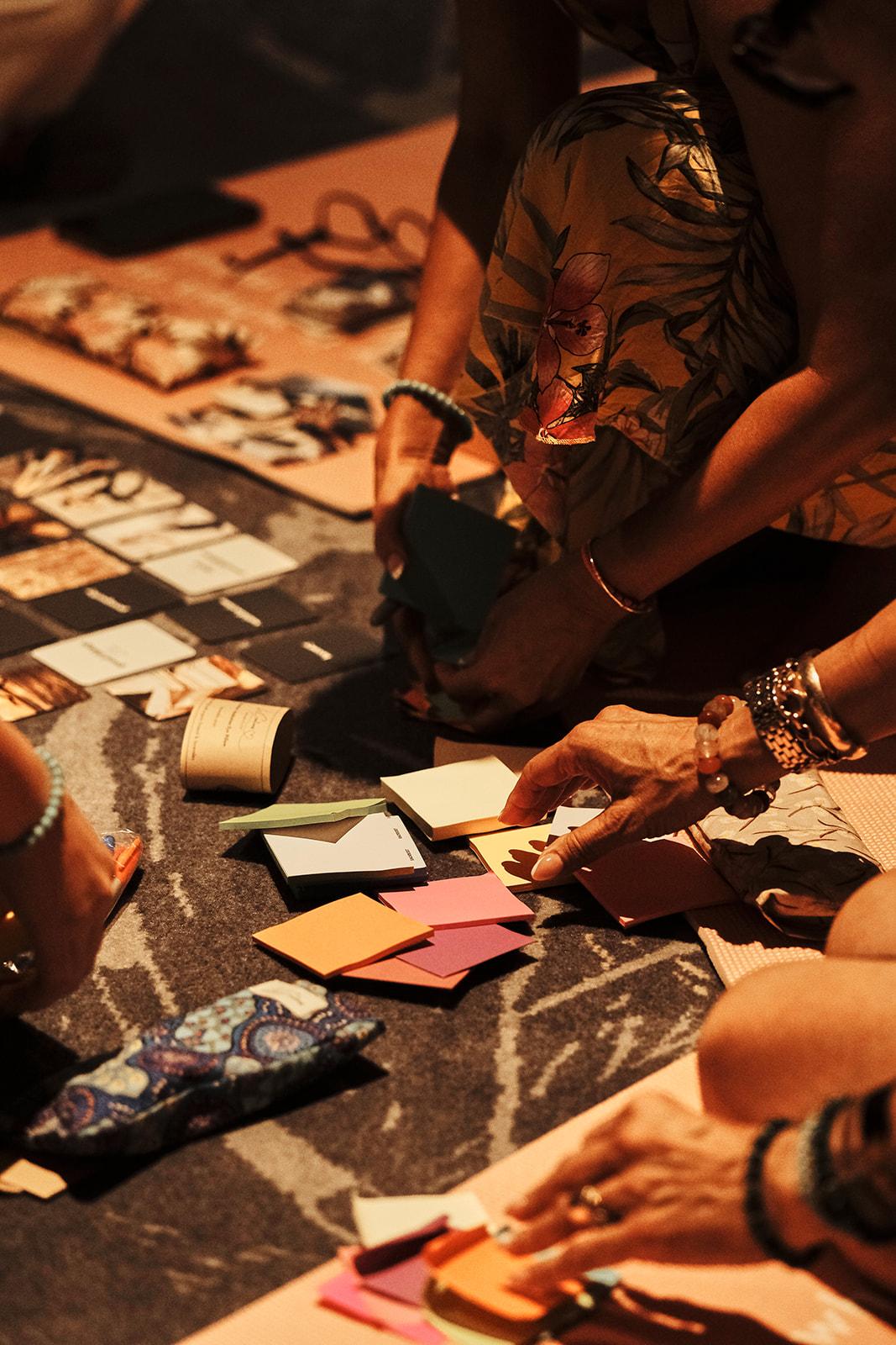 Cards spread out on a mat during a guided reflection exercise