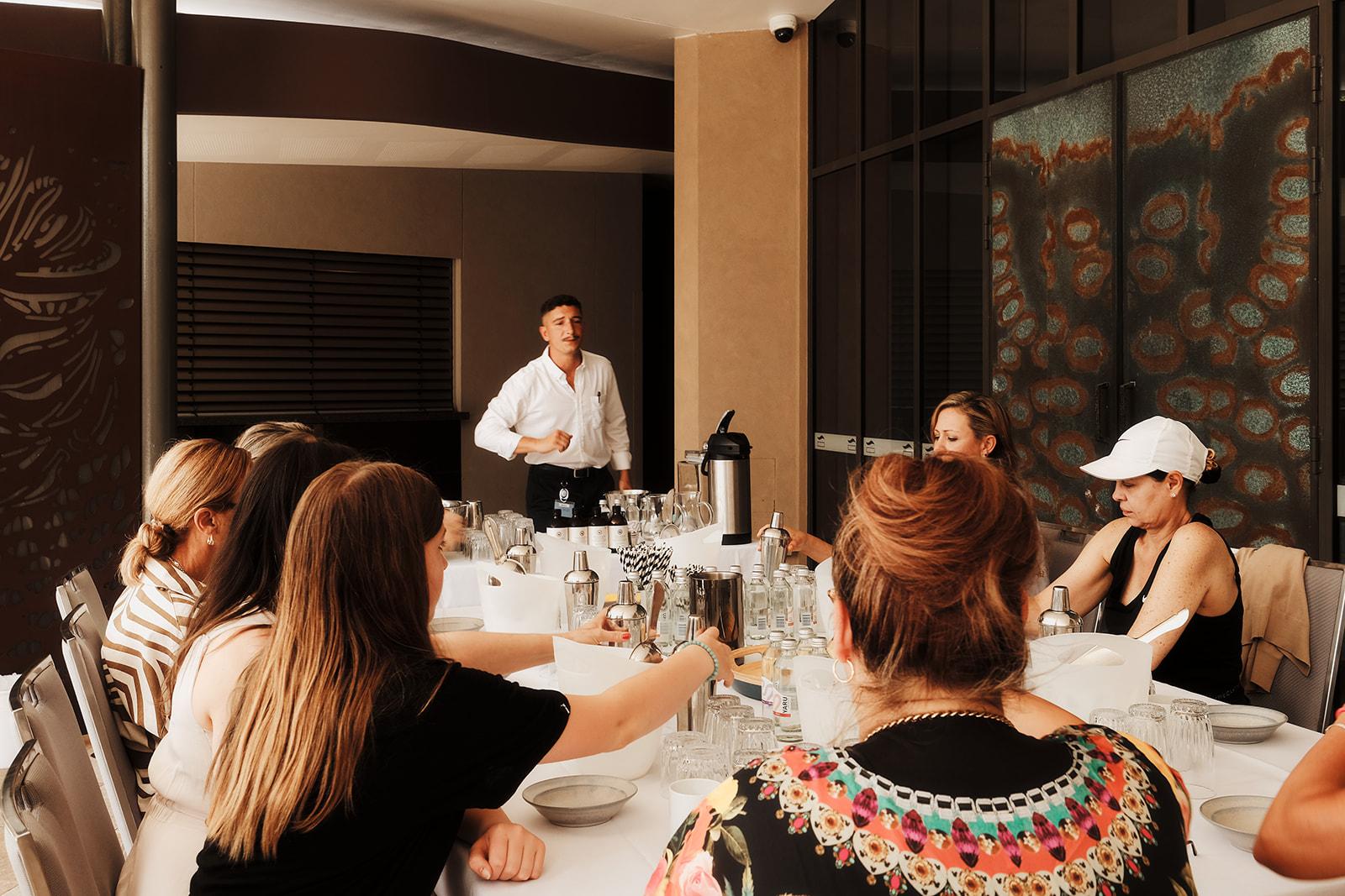 The group seated around tables during one of the retreat's sessions