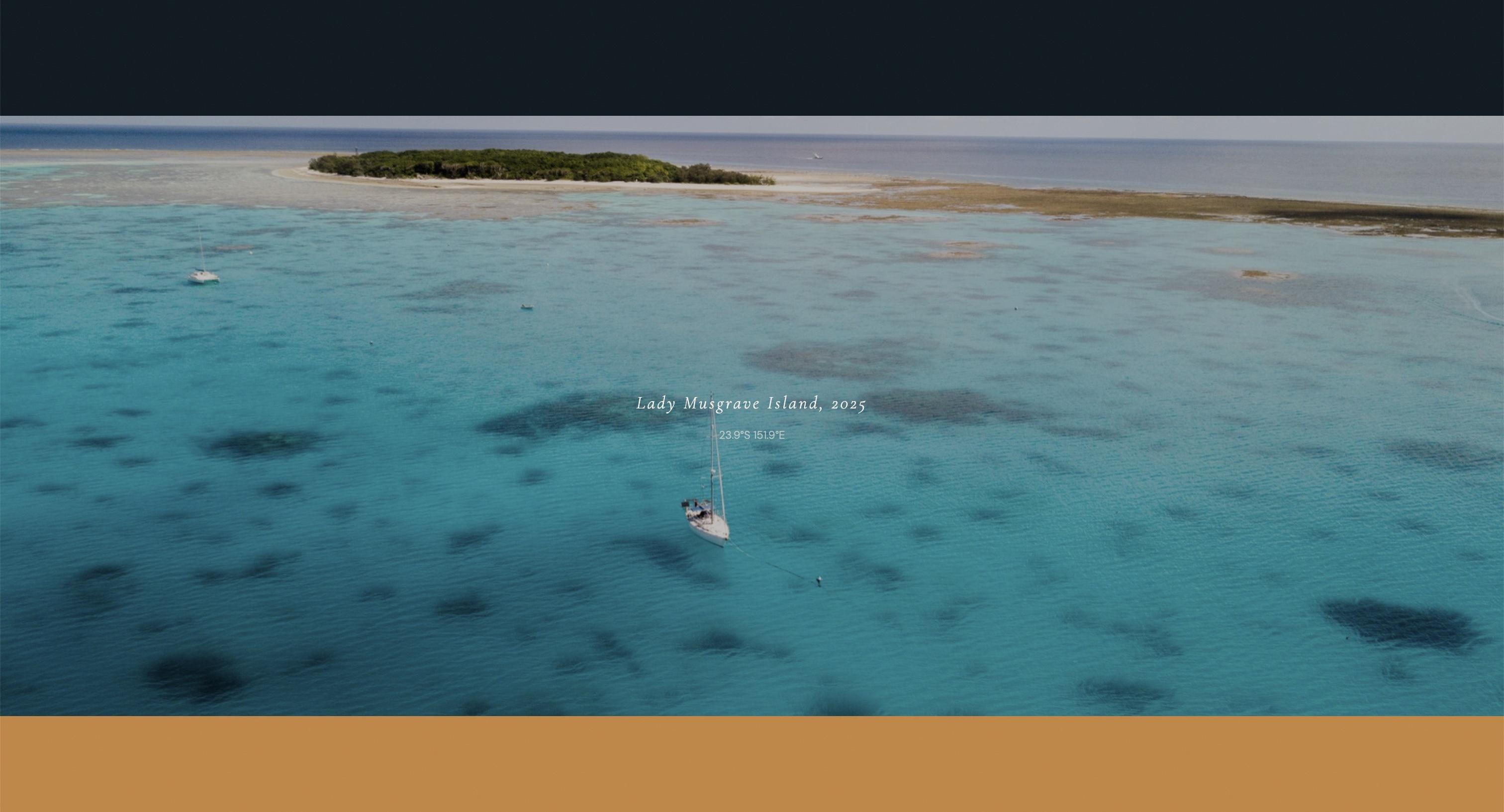 Aerial drone photo of a sailboat anchored off Lady Musgrave Island, 2025, with coordinates overlaid