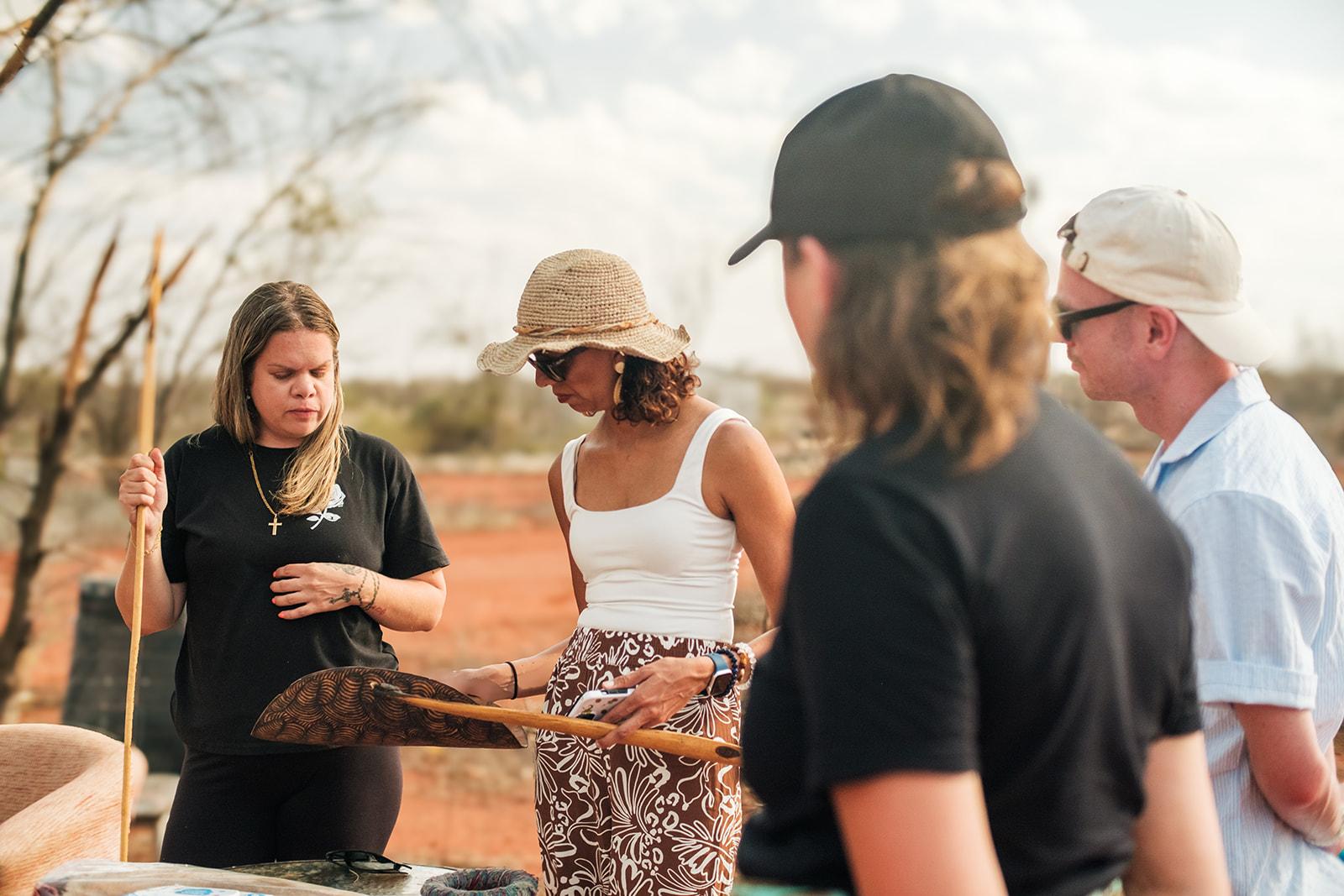 The group gathered in conversation out in the bush