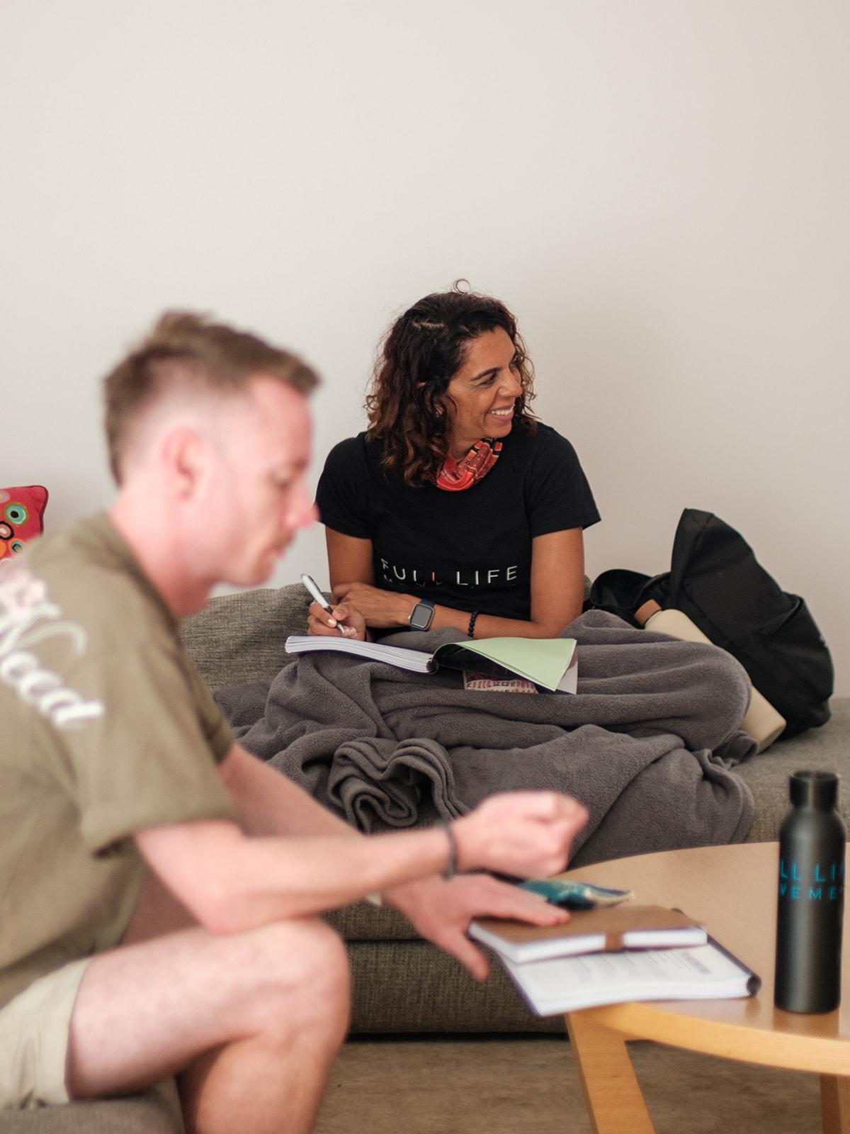 A one-on-one mentoring conversation on a couch