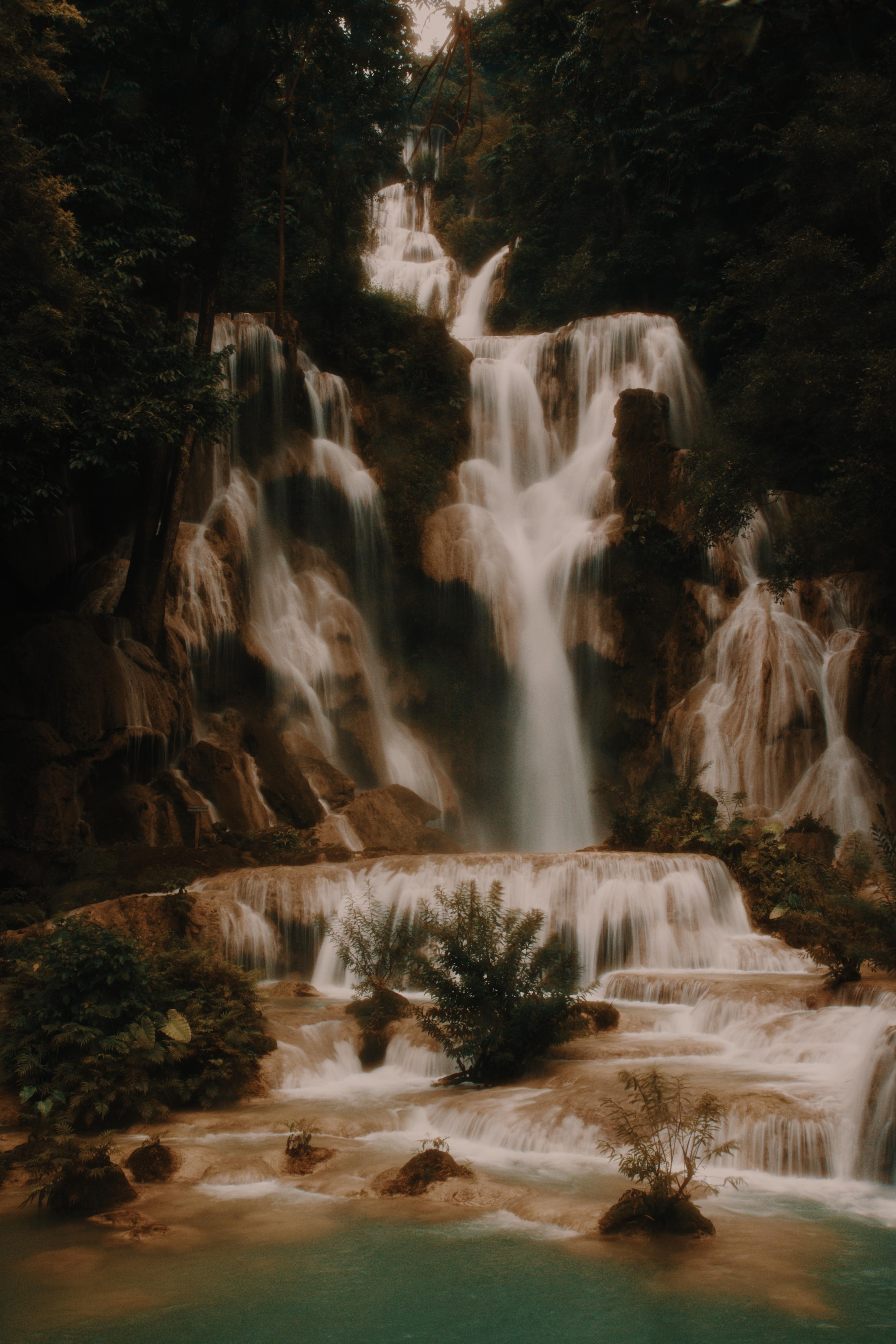 The same waterfall from another angle, water blurred smooth across the tiers